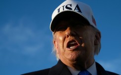 US President Donald Trump speaks to reporters before boarding Air Force One as he departs Joint Base Andrews in Maryland on March 13, 2026