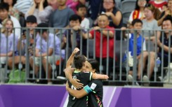 Australia's Sam Kerr (R) Caitlin Foord celebrate a goal during their Women’s Asian Cup semi-final win over China