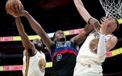 Golden State's Draymond Green blocks a shot attempt by Jalen Duren in the Warriors' NBA loss to the Detroit Pistons