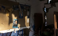 A portrait of Israeli Prime Minister Benjamin Netanyahu on the wall of a kindergarten damaged in an Iranian missile strike in Dimona on March 22