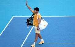 Early exit: World number one Carlos Alcaraz waves to fans after falling to 36th-ranked Sebastian Korda in the third round of the Miami Open