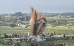 Smoke rises from an Israeli airstrike on the Qasmiyeh bridge in south Lebanon