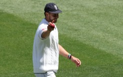 England's Josh Tongue holds the ball up after taking five wickets during the first day of the fourth Ashes Test against Australia at the Melbourne Cricket Ground (MCG) in December