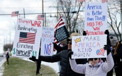 Demonstrators take part in the 'No Kings' national day of protest in West Bloomfield, Michigan, a suburb of Detroit