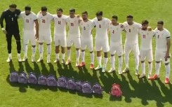 This video grab taken from images released by the Iranian state broadcaster (IRIB) on March 27, 2026 and released via AFPTV, shows the country's football national team paying tribute to the victims of the February 28 strike on an elementary school in Minab, ahead of their friendly football match with Nigeria in Turkey's Antalya
