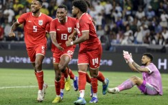 Jiovany Ramos (2L) celebrates after scoring the winner for Panama against South Africa in Cape Town.