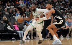 Boston Celtics star Jaylen Brown drives past Ousmane Dieng in the Celtics' NBA victory over the Milwaukee Bucks