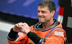 NASA astronaut Reid Wiseman gestured a heart sign before the Artemis II took off to orbit the Moon, where astronauts proposed for a crater to be named "Carroll" in honor of his deceased wife