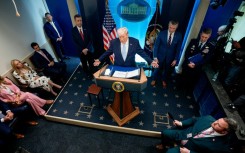 US President Donald Trump -- accompanied by CIA Director John Ratcliffe (C-L), Secretary of Defense Pete Hegseth (2nd-R) and Chairman of the Joint Chiefs of Staff General Dan Caine (R) -- speaks during a news conference at the White House on April 06, 2026