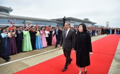 Chinese Foreign Minister Wang Yi (C) is welcomed by North Korean Foreign Minister Choe Son-hui (R) upon arriving on a two-day visit at Pyongyang International Airport on April 9, 2026.