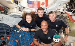 Christina Koch (L), Jeremy Hansen (top), Reid Wiseman (R), and Victor Glover (bottom) posing for a group photo inside the Orion spacecraft on April 7, 2026