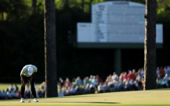 World number one Scottie Scheffler reacts after a missed putt on the 15th green during the first round of the 90th Masters