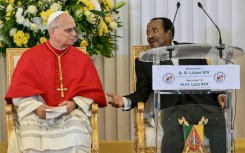 Pope Leo XIV urged an end to the conflict in a pointed speech next to Cameroon's President Paul Biya (R)