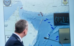US Chairman of the Joint Chiefs of Staff General Dan Caine shows a map of the Strait of Hormuz at a Pentagon press briefing