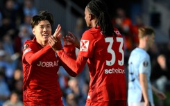 Freiburg's Japanese midfielder Yuito Suzuki (L) celebrates scoring against Celta Vigo