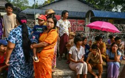Relatives wait for the release of prisoners from Insein prison to mark the Myanmar New Year in Yangon