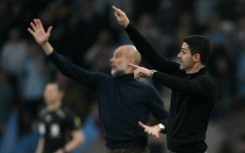 Pep Guardiola's (L) Manchester City are trying to usurp Mikel Arteta's (R) Arsenal at the top of the Premier League