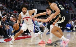 Cade Cunningham of the Detroit Pistons drives during an NBA game against the Milwaukee Bucks
