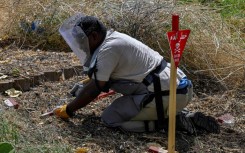 Anti-mine teams have cleared thousands of explosives from around Sudan's capital