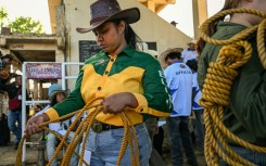 Rizza Matutino preparing to compete in the casting down event during the Rodeo Festival in Masbate