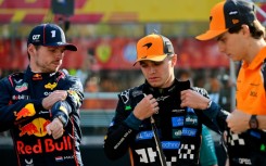 McLaren duo Lando Norris (C) and Oscar Piastri (R) feel F1 would be worse off if Max Verstappen were to walk away from the spot