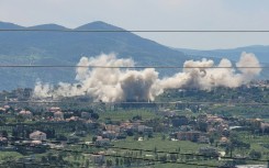 Smoke billows from explosions in the southern Lebanese village of Khiam, where the Israeli army has demolished residents' homes