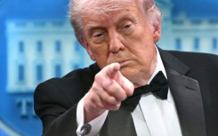 US law enforcement said they detained the sole shooter who charged a glitzy media gala attended by President Donald Trump