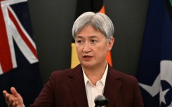 Australia's Foreign Minister Penny Wong addresses journalists during a press conference in Beijing