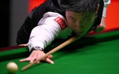 Reigning champion Zhao Xintong of China has been knocked out of the World Snooker Championship by Shaun Murphy