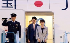 Japan's Prime Minister Sanae Takaichi (R) disembarks a plane upon arrival at Noi Bai International Airport in Hanoi on May 1, 2026.