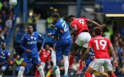 Nottingham Forest striker Taiwo Awoniyi (2nd R) heads the opening goal against Chelsea