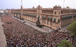 In this handout picture released by Mexico's presidencial press office, some 50,000 fans of South Korea's K-pop band BTS came to see the band at the Palacio Nacional in Mexico City