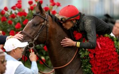 Jockey Jose Ortiz celebrates his Kentucky Derby victory aboard Golden Tempo