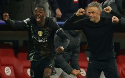 PSG coach Luis Enrique (R) and Ousmane Dembele begin the celebrations after holding off Bayern Munich to reach another Champions League final