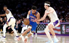 Oklahoma City's Ajay Mitchell drives to the basket against Austin Reaves of the Los Angeles Lakers in the Thunder's win in game three of their NBA playoff series
