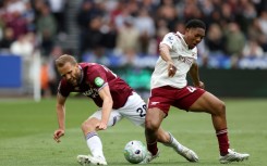 Arsenal's Myles Lewis-Skelly (R) tackles West Ham's Tomas Soucek (L) during the Gunners' 1-0 Premier League win at the London Stadium