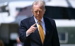 US President Donald Trump, pictured boarding Air Force One on May 12, 2026, notified Congress of strikes against Iran in early March