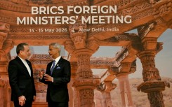 India's Foreign Minister Subrahmanyam Jaishankar (R) speaks to Iranian counterpart Abbas Araghchi at the opening of the BRICS Foreign Ministers’ Meeting in New Delhi
