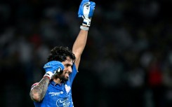 Tilak Varma celebrates after powering Mumbai Indians to victory over Punjab Kings.