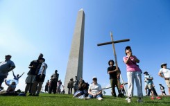 Christian worshippers gathered in the shadow of the Washington Monument for a weekend 'National Jubilee of Prayer' in the nation's capital