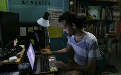 Alejandro Benitez a fourth-year Cuban architecture student, works during the night to try finish assignments that get delayed by incessant power outages