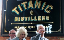 Charles and Camilla sample whiskey during a visit to Titanic Distillers in Belfast, Northern Ireland