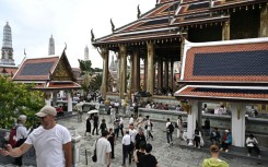 Visitors walking around the Grand Palace in Bangkok