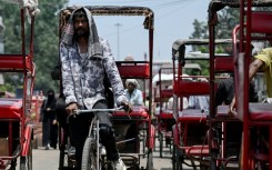 A rickshaw puller in Delhi, where temperatures hit 45C on Thursday. The South Asian country of 1.4 billion people is no stranger to scorching summers, with routine heatwaves between April and June