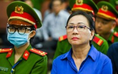 Truong My Lan (right) was initially sentenced to death, but now faces life in prison after Vietnam abolished capital punishment