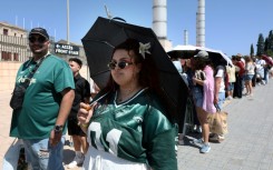 Fans queue outside the Estadi Olimpic Lluis Companys in Barcelona ahead of Bad Bunny's first concert in the Spanish city