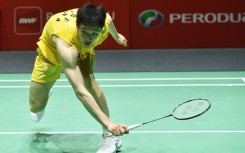 Li Shifeng of China in action against Panitchaphon Teeraratsakul of Thailand during their men's single final match