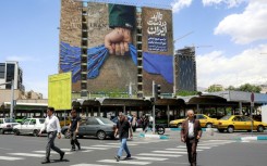 Oil prices fell and Asian stocks climbed on Monday over hopes a deal between the United States and Iran to open the Strait of Hormuz could be brokered