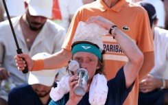 Andrey Rublev used an ice bag to cool off at the French Open on Monday
