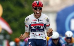Soudal Quick-Step's French rider Paul Magnier celebrates as he wins the 18th stage of the Giro d'Italia at Pieve di Soligo